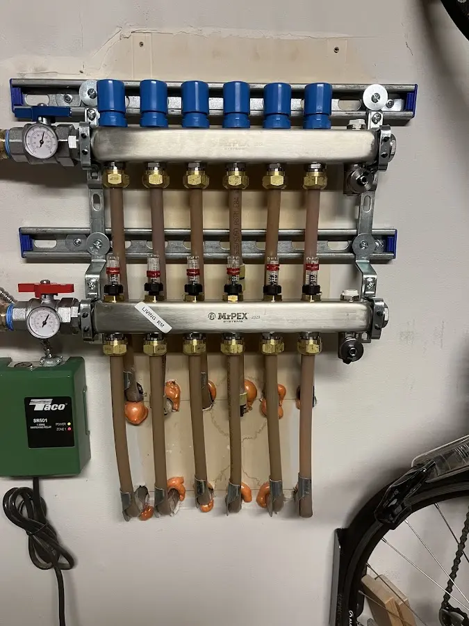 Plumber performing Gas Line Installation at a residential property in Simsbury